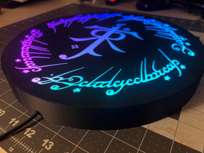 LOTR Tolkien Monogram & The One Ring Script Wall Sign, Desk Display, or Shelf Souvenir which is internally illuminated with high density LEDs and USB powered. Purchase available for limited time.