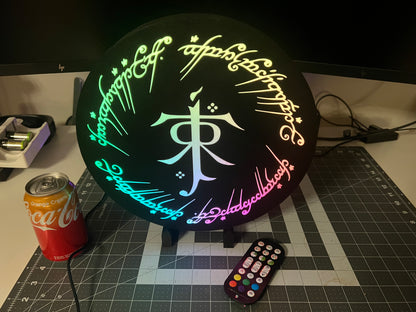 LOTR Tolkien Monogram & The One Ring Script Wall Sign, Desk Display, or Shelf Souvenir which is internally illuminated with high density LEDs and USB powered. Purchase available for limited time.