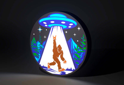 Sasquatch (Bigfoot) and UFO Inspired Cryptid Wall Sign, Desk Display, or Shelf Souvenir which is internally illuminated with high density LEDs and USB powered. Purchase available for limited time.