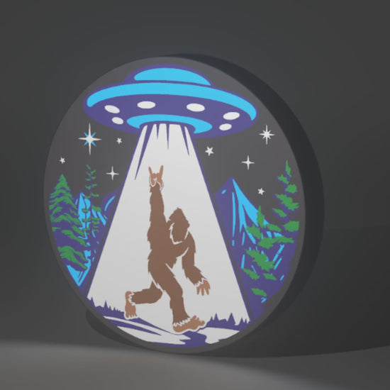 Sasquatch (Bigfoot) and UFO Inspired Cryptid Wall Sign, Desk Display, or Shelf Souvenir which is internally illuminated with high density LEDs and USB powered. Purchase available for limited time.